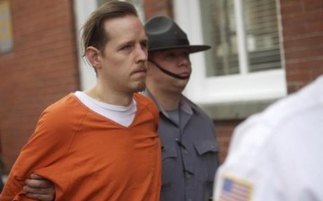 Eric Matthew Frein exits the Pike County Courthouse with police officers after an arraignment in Milford, Pennsylvania, October 31, 2014. 