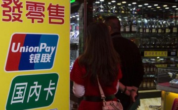 Shoppers browse through the products in a store that accepts UnionPay cards.