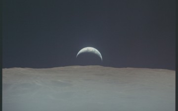 Earthrise from lunar surface during Apollo 12 mission.
