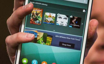  The new Samsung Galaxy Tab 4 Nook is held up for display at a media event on August 20, 2014 in New York City. The new tablet has a 7-inch screen and will cost $179.