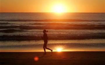 Woman Running on a Beach