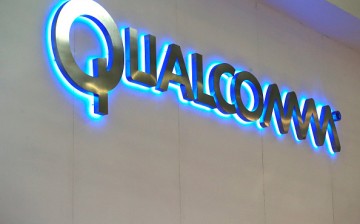 A logo sits illuminated outside the Qualcomm Inc. pavilion at the Mobile World Congress in Barcelona, Spain, on Monday, March 2, 2015. 
