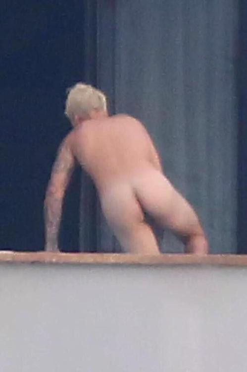 Justin Bieber returns to his room after a skinny dip at his private pool.