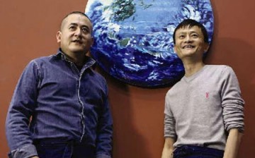 Zeng Fanzhi and Jack Ma pose with their oil painting entitled 