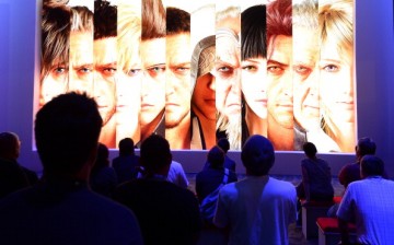 Attendees watch a trailer for Square Enix Unveils Final Fantasy XV video game at the E3 Electronic Entertainment Expo, in Los Angeles, California June 12, 2013.