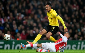 Pierre-Emerick Aubameyang of Borussia Dortmund is tackled by Kieran Gibbs of Arsenal during their UEFA Champions League Group D match.