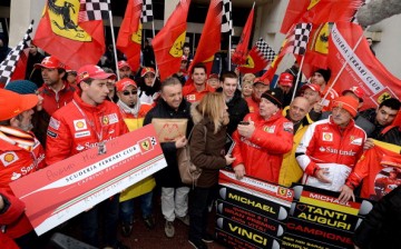 Fans gathered in front of the main entrance of Grenoble University Hospital Centre where former German Formula One driver Michael Schumacher was being treated for a severe head injury following a skiing accident on January 3, 2014 in Grenoble, France. 