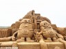 A sand sculpture featuring minions is on display at a beach park in Changde City, Hunan Province, Oct 10, 2015. 