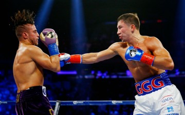 Gennady Golovkin (R) beats up David Lemieux during their middleweight unification title fight.