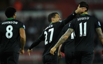 Stoke City winger Bojan Krkic (#27) celebrates with Joselu after scoring their first goal from the penalty spot against Swansea City.