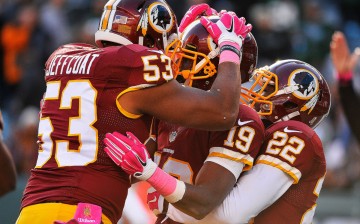 Washington Redskins' Rashad Ross (#19) is congratulated by teammates Jackson Jeffcoat (#53) and Stevan Ridley (#22) after scoring a fourth quarter touchdown against the New York Jets last week.