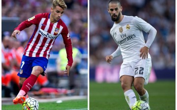 Atletico Madrid's Antoine Griezmann (L) and Real Madrid's Isco.