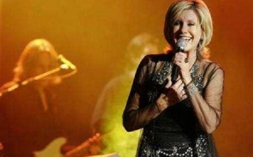 Olivia Newton-John is seen performing at a concert in Singapore.