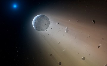 In this artist’s conception, a tiny rocky object vaporizes as it orbits a white dwarf star. Astronomers have detected the first planetary object transiting a white dwarf using data from the K2 mission. Slowly the object will disintegrate, leaving a dustin