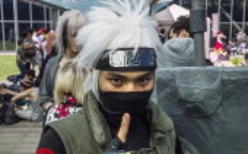A man dressed as a character from the Japanese anime 'Naruto' poses as he attends the 15th edition of the 'Japan Expo' exhibition devoted to Japanese culture and entertainment on July 2, 2014 in Villepinte, a Paris suburb.