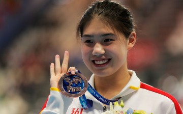 Yufei Zhang poses during the medal ceremony for the Women's 200m Butterfly at the 16th FINA World Championships at the Kazan Arena on Aug. 6, 2015, in Kazan, Russia.