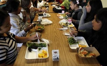 Students sit down to eat a healthy lunch at Marston Middle School in San Diego.