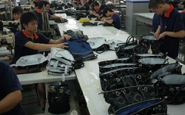 Workers make the final check on products made by a factory in Dongguan, China's manufacturing hub.