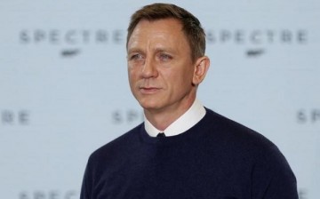 Actor Daniel Craig poses on stage during an event to mark the start of production for the new James Bond film 'Spectre' 