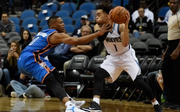 Minnesota Timberwolves rookie point guard Tyus Jones (R) goes against Oklahome City Thunder's Russell Westbrook.