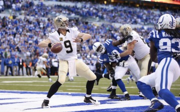 New Orleans quarterback Drew Brees (#9) looks to pass the ball against the Indianapolis Colts.
