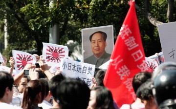 Demonstrators hold an anti-Japanese protest outside the Japanese Embassy on Sept. 15, 2012 in Beijing, China. China is set to resume talks with Japan and South Korea for the first time in three years.