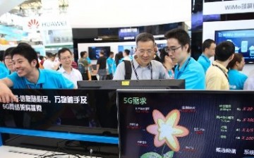 Spectators take a look at the 5G technology during the Mobile World Congress in Shanghai in July.