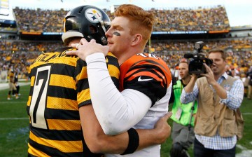 Cincinnati Bengals quarterback Andy Dalton (R) talks with Pittsburgh Steelers quarterback Ben Roethlisberger after their match on Sunday.