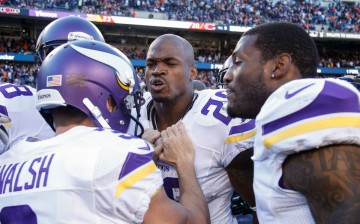 Minnesota Vikings kicker Blair Walsh (#3) celebrates the winning field goal versus the Chicago Bears with Adrian Peterson and his teammates.
