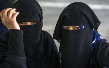 Windows of the soul: Only the eyes and some skin are made visible by the burqa, also called paranja or chadri, worn by these women.