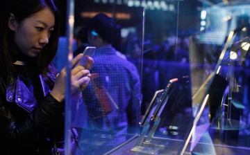 A woman takes a photo of a Vertu phone at the product's launch in Shanghai last year.