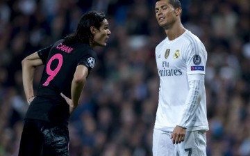 Real Madrid's Cristiano Ronaldo (R) talks with PSG's Edinson Cavani during their recent Champions League match.