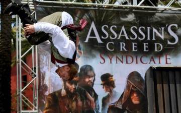 A performer does a flip during an obstacle course at the “Assassin's Creed Syndicate”