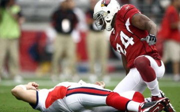 Starting Quarterback Trent Edwards #5 of the Buffalo Bills suffers a concussion after getting hit by Strong Safety Adrian Wilson #24 of the Arizona Cardinals during the first half of their NFL Game on