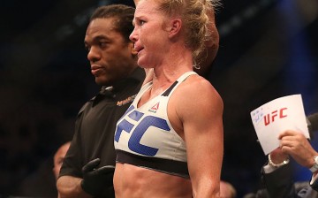 Holly Holm celebrates victory over Ronda Rousey in their UFC women's bantamweight championship bout during the UFC 193 event at Etihad Stadium on November 15, 2015 in Melbourne, Australia. 