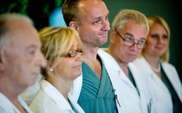 Professor Mats Brannstrom (C), head of a medical team which performed its first uterus transplant on a patient, attends a news conference