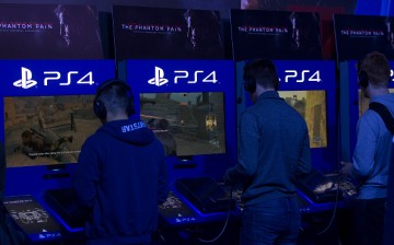 Gamers play the video game Metal Gear Solid, on the Sony Corp. Playstation 4, at the EGX 2015 video gaming conference in Birmingham, U.K., on Thursday, Sept. 24, 2015. 