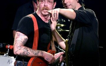 Jesse Hughes and Josh Homme of American rock band Eagles of Death Metal are performing at a 2015 Los Angeles music concert 