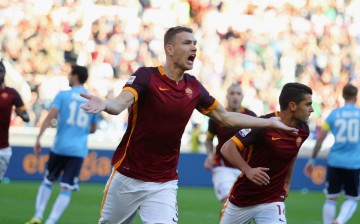 Roma striker Edin Džeko celebrates after scoring the opening goal against SS Lazio.