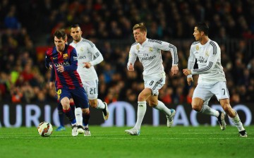 FC Barcelona forward Lionel Messi dribbles past Real Madrid's Jese, Toni Kroos, and Cristiano Ronaldo during last March's El Clásico.