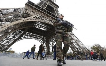 French military patrol near the Eiffel Tower the day after a series of deadly attacks.
