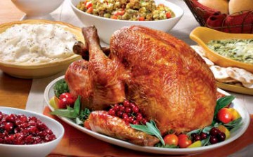 A typical Thanksgiving table usually includes a turkey and some side dish.