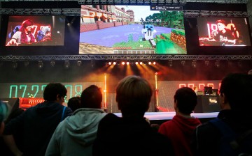 Visitors watch as professional gamers and members of the audience compete at Minecraft on the main stage at the Legends of Gaming Live event in London, on Saturday, Sept. 5, 2015. 
