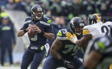Seattle Seahawks quarterback Russell Wilson (#3) prepares to pass the ball against the Pittsburgh Steelers.