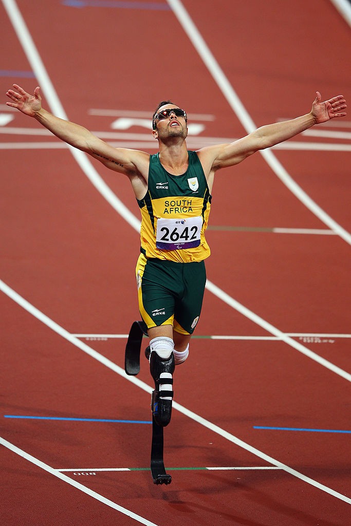 LONDON, ENGLAND - SEPTEMBER 08: Oscar Pistorius of South Africa celebrates winning the Men's 400m ¿ T44 final on day 10 of the London 2012 Paralympic Games at Olympic Stadium on September 8, 2012 in London, England. (Photo by Hannah Peters/Getty Images)