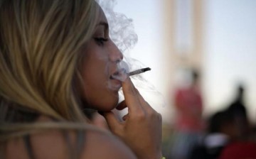 |Woman Smoking Cannabis Cigarette