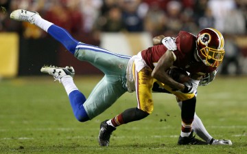 Washington Redskins wide receiver DeSean Jackson (R) was sacked by Dallas Cowboys' Brandon Carr.