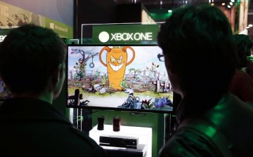 A visitor plays a game on a XBox One on October 28, 2015 at the Paris Game Week, a trade fair for video games in Paris. Paris Game week will run from October 28 until November 1, 2015. 