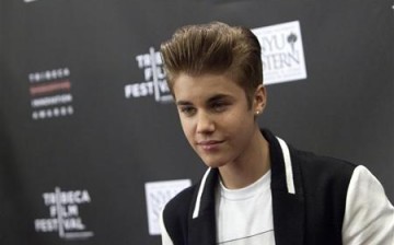 Justin Bieber attends the 3rd annual Tribeca Disruptive Innovation Awards during the 2012 Tribeca Film Festival at NYU Paulson Auditorium in New York April 27, 2012.