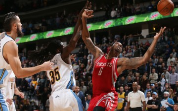 Houston Rockets power forward Terrence Jones (R) battles Denver Nuggets' Kenneth Faried for the rebound. Jones is the subject of many recent NBA trade rumors, including links to the Suns and Pelicans.